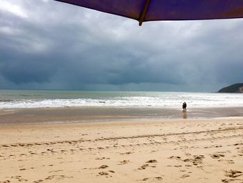 Scenic view of beach against sky