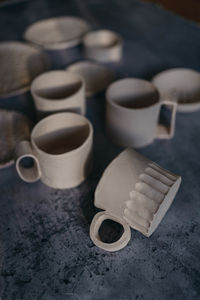 High angle view of coffee cups on table