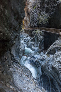 High angle view of waterfall along trees