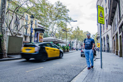 Rear view of man on street in city