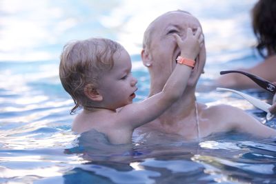 Portrait of boy swimming in sea