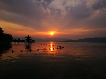 Scenic view of lake during sunset