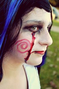 Close-up of woman with spooky halloween make-up