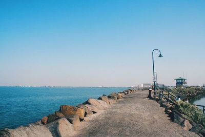 Scenic view of sea against clear blue sky