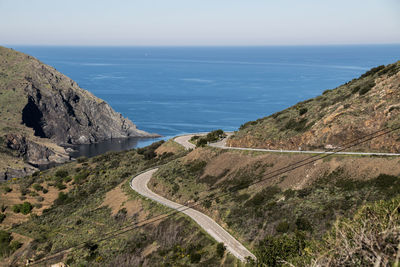 High angle view of road by sea against sky