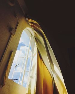 Low angle view of yellow window