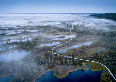 Aerial view of footbridge against sky