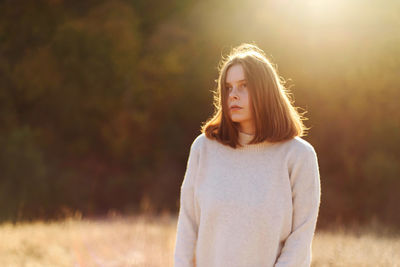 Beautiful portrait of a young stylish woman on a sunny day in autumn