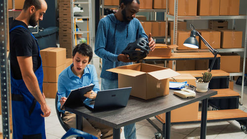 Rear view of man working at office