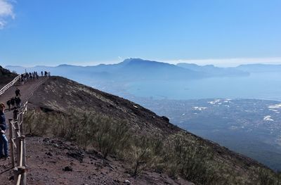 Scenic view of mountains against clear blue sky