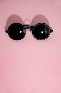 Close-up of sunglasses against black background