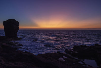 Scenic view of sea against sky during sunset