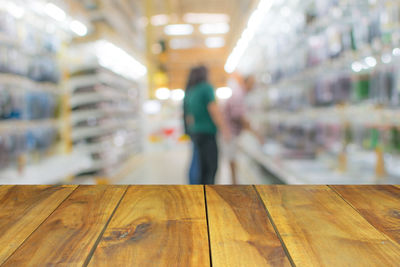 Woman standing on wooden floor