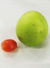 Close-up of green fruits on table