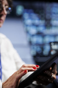 Midsection of woman using laptop