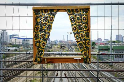 Temporary window at railing of footbridge