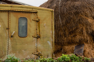 View of abandoned vehicle on field