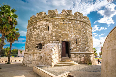 Low angle view of old ruins against sky