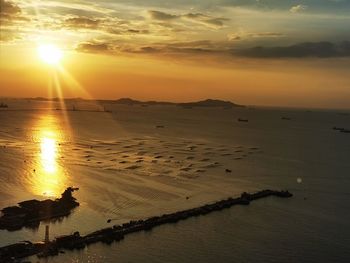 Scenic view of beach against sky during sunset