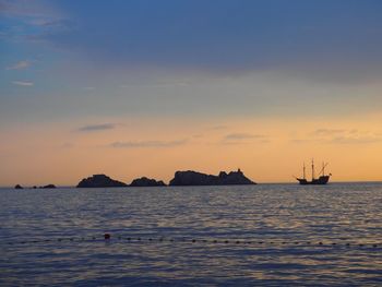 Scenic view of sea against sky during sunset