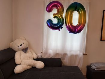 Teddy bear on sofa at home