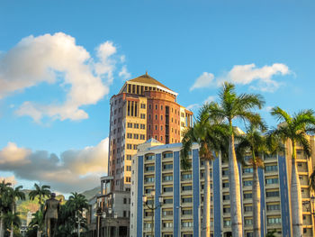 Low angle view of building against cloudy sky