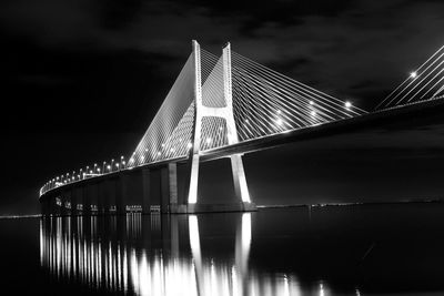 Low angle view of bridge against sky at night