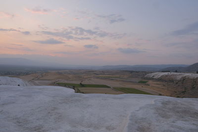 Scenic view of landscape against sky during sunset