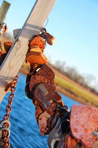 Close-up of rusty chain against clear sky