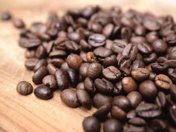 Close-up of coffee beans on table
