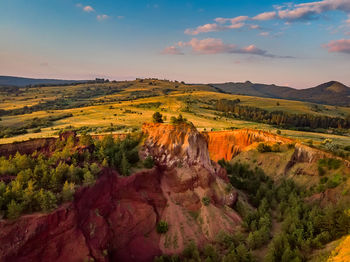 Scenic view of landscape against sky during sunset