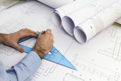 High angle view of man working on table