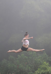 Young woman jumping