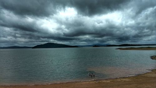 Scenic view of sea against cloudy sky