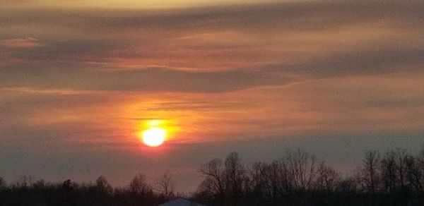 Scenic view of dramatic sky during sunset