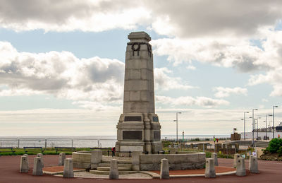 View of tower against cloudy sky