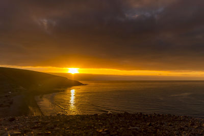 Scenic view of sea against sky during sunset