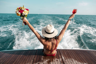 Happy woman on the ship. holiday in summer