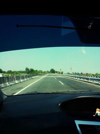 Cropped image of car on road