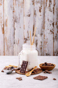 Close-up of ice cream in jar on table