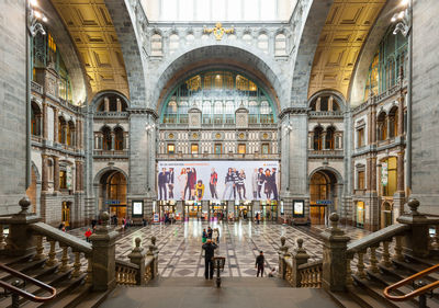 People walking in historic building