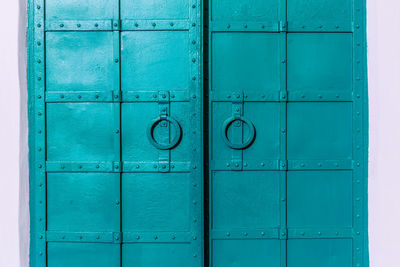 Closed blue door of building