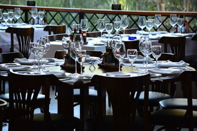 Empty chairs and tables in restaurant