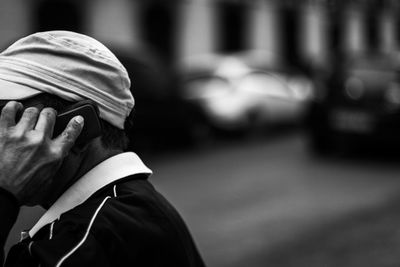 Close-up of man with mobile phone