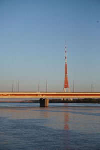 View of tower bridge over sea against clear sky