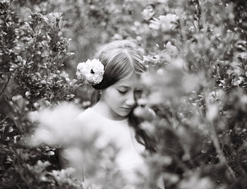 Bride amidst plants