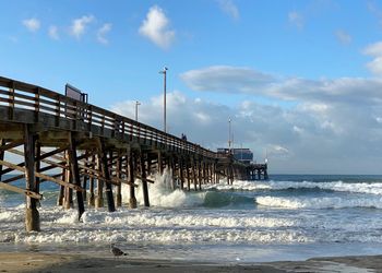 Pier over sea against sky