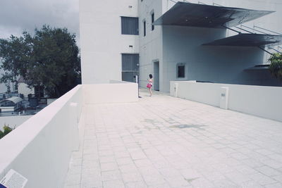Man in front of built structure