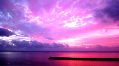 Scenic view of sea against dramatic sky