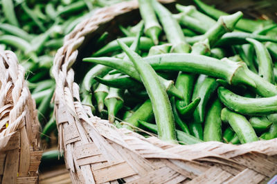 Close-up of green chili peppers in basket